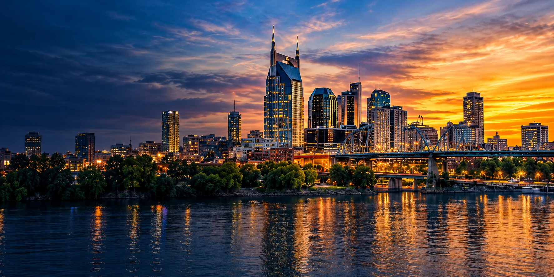 Nashville skyline with the AT&T building, bridge and Cumberland River at sunset